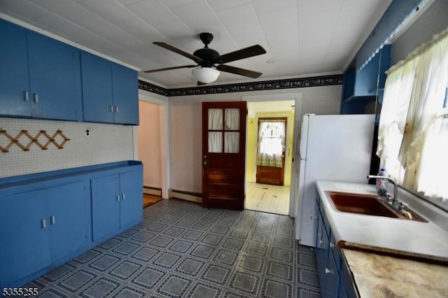 5634 Berkshire Valley Rd, Jefferson Twp, NJ 07438 - kitchen featuring a ceiling fan, blue cabinets, a sink, backsplash, and light countertops