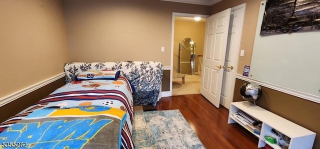bedroom with wood finished floors