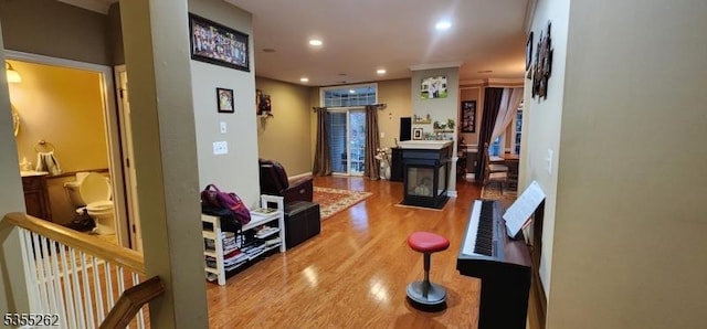 corridor with recessed lighting and wood finished floors
