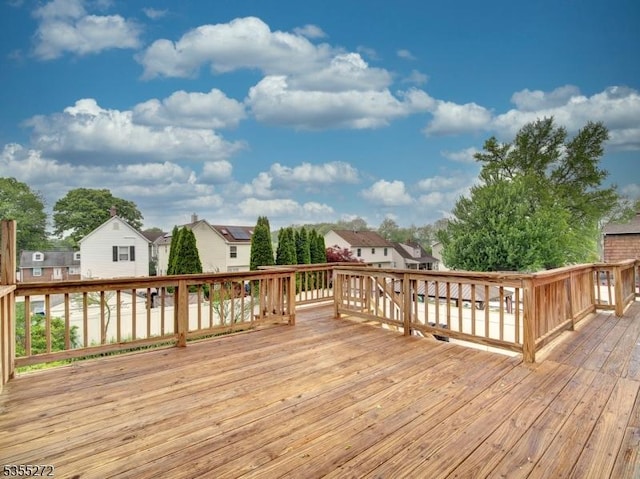 wooden deck with a residential view
