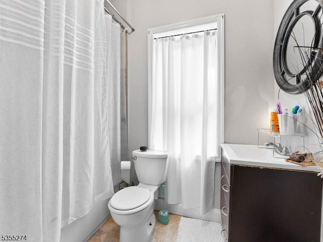 full bathroom featuring vanity, tile patterned flooring, and toilet