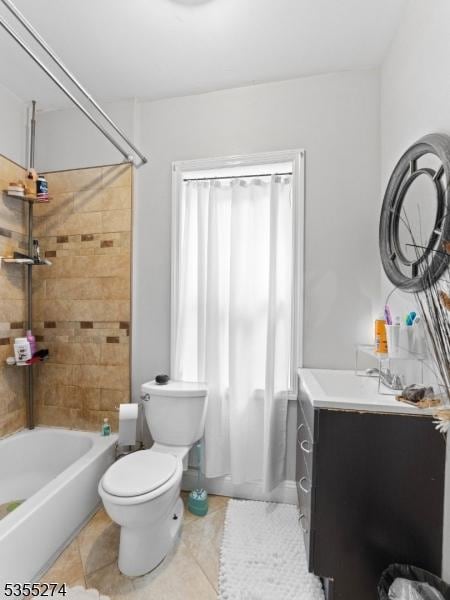 bathroom featuring vanity, tile patterned flooring, toilet, and shower / washtub combination