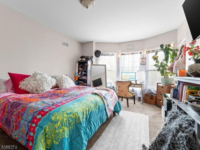 carpeted bedroom with visible vents