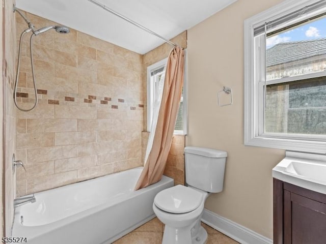 full bathroom featuring shower / bath combo with shower curtain, baseboards, plenty of natural light, and toilet