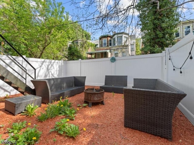 view of patio / terrace featuring an outdoor living space and a fenced backyard