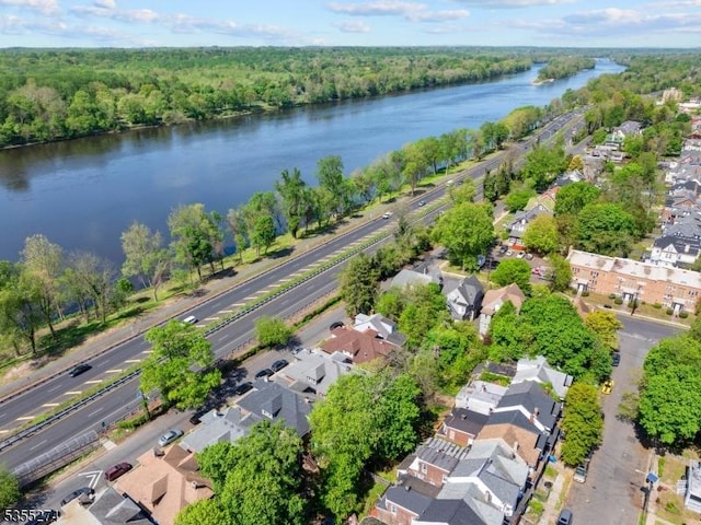 bird's eye view featuring a residential view, a water view, and a forest view
