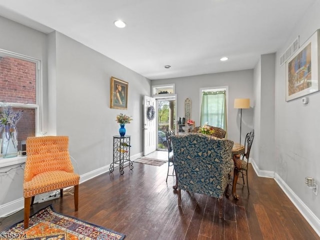 dining space with baseboards, recessed lighting, visible vents, and hardwood / wood-style floors
