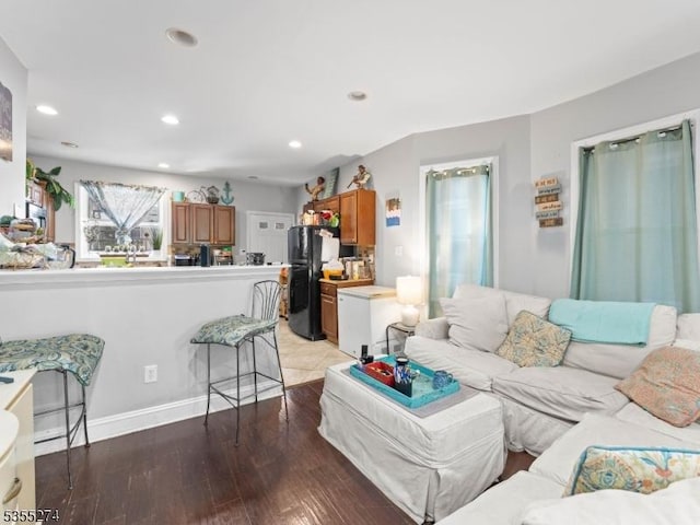 living room with recessed lighting and light wood finished floors