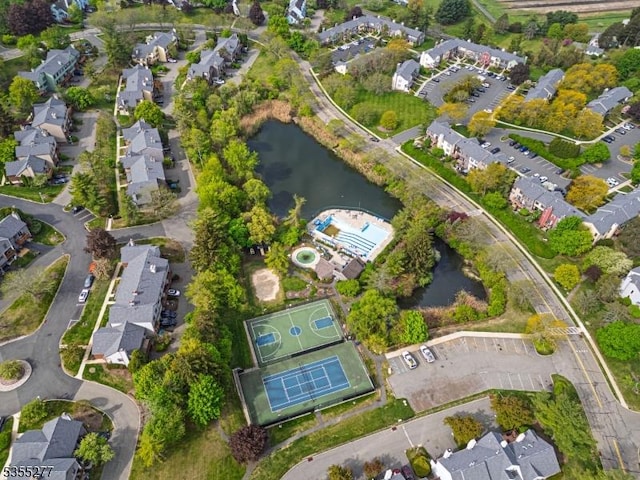 bird's eye view with a residential view and a water view