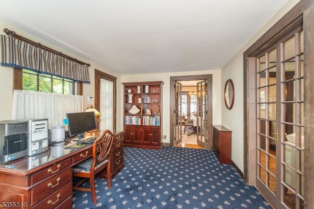 office area with carpet floors, french doors, and baseboards