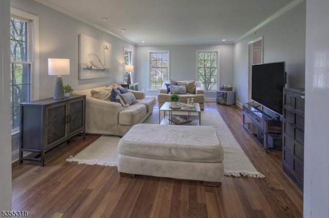 living room with baseboards, ornamental molding, recessed lighting, and wood finished floors