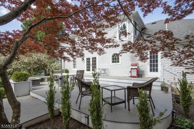 view of patio / terrace featuring a wooden deck and outdoor dining space