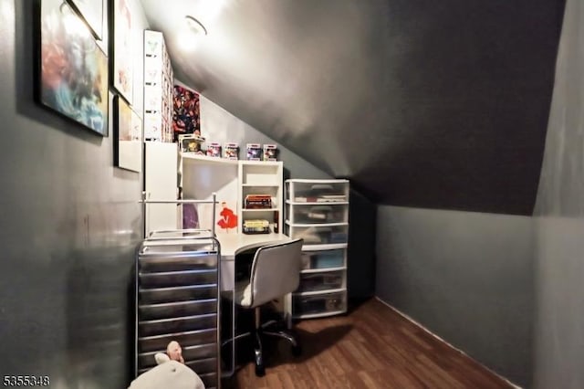 home office featuring dark wood-style flooring, vaulted ceiling, and baseboards