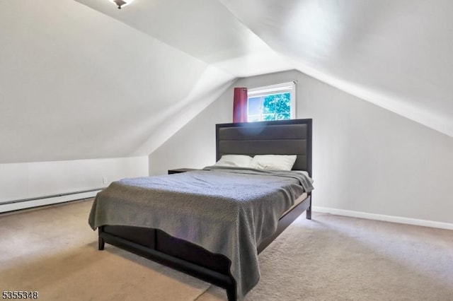 bedroom with carpet flooring, lofted ceiling, a baseboard radiator, and baseboards