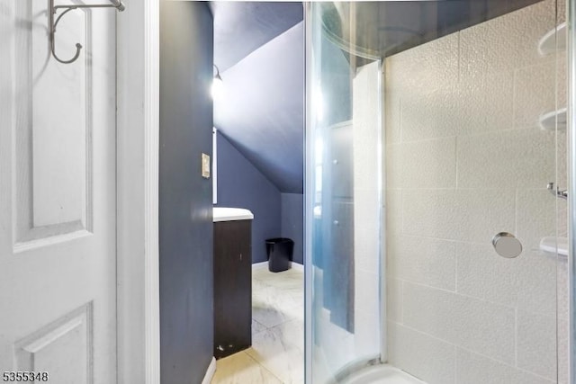 full bath featuring a shower stall and lofted ceiling