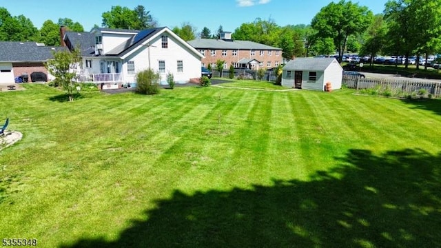 view of yard with an outdoor structure and a storage unit