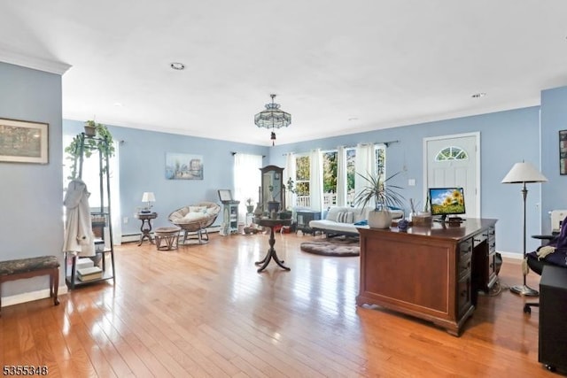 office area with light wood-type flooring and baseboards