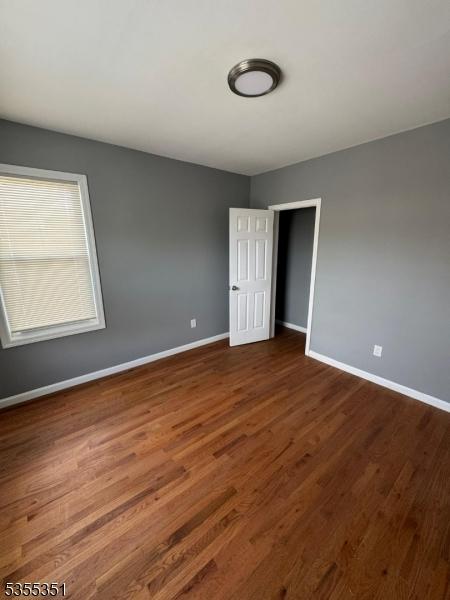 385 Stiles St, Union Twp, NJ 07088 - unfurnished room with baseboards and dark wood finished floors