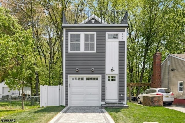 garage with fence and driveway