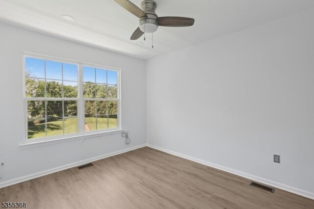 4703 Patterson St, Bridgewater Twp, NJ 08807 - empty room with wood finished floors, baseboards, and ceiling fan