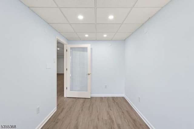 4703 Patterson St, Bridgewater Twp, NJ 08807 - unfurnished room with wood finished floors, recessed lighting, baseboards, a drop ceiling, and french doors