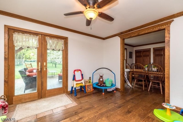 game room with french doors, wood finished floors, ornamental molding, a ceiling fan, and baseboards