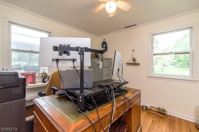 office with wood finished floors, vaulted ceiling, crown molding, a ceiling fan, and plenty of natural light