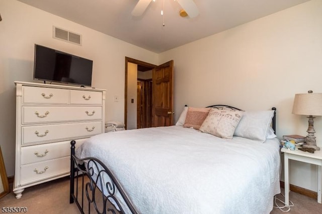 bedroom with dark colored carpet, baseboards, and ceiling fan