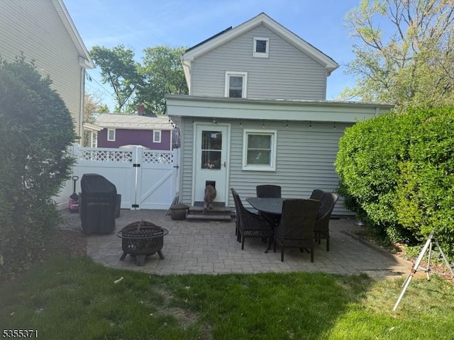 11 Union St, Franklin Twp, NJ 08528 - rear view of house with a fire pit, a patio, a gate, and fence