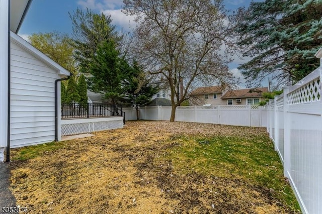 view of yard with a fenced backyard
