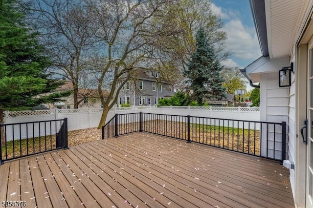 wooden terrace featuring a fenced backyard