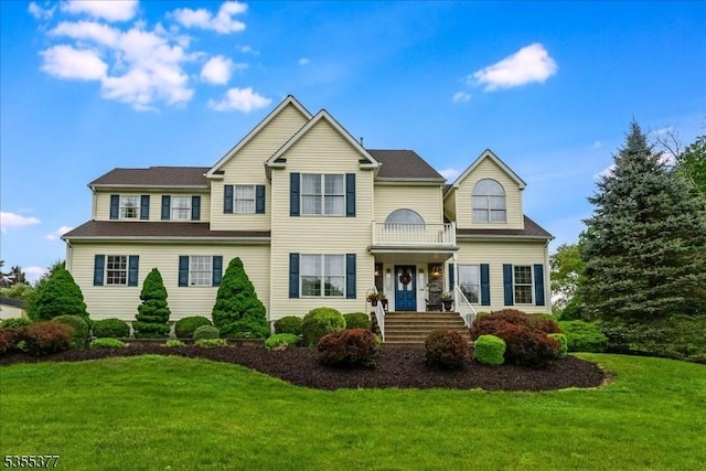view of front of home with a front lawn