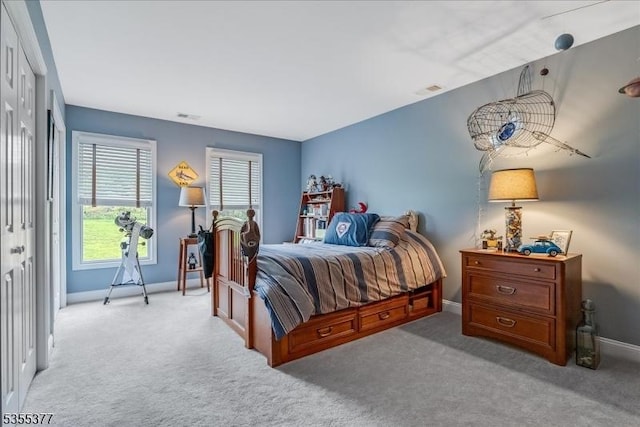 bedroom with carpet flooring and baseboards