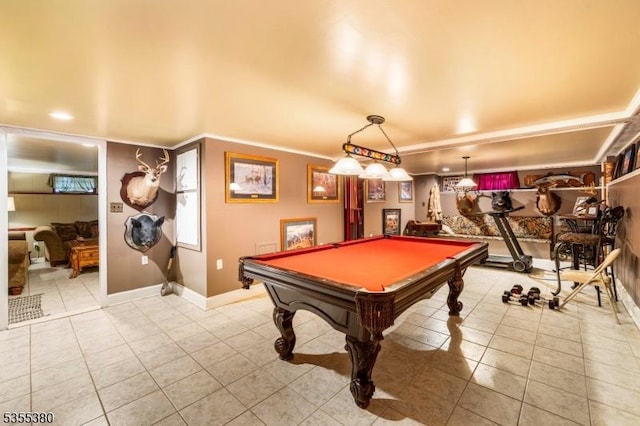 rec room with crown molding, pool table, baseboards, and light tile patterned floors