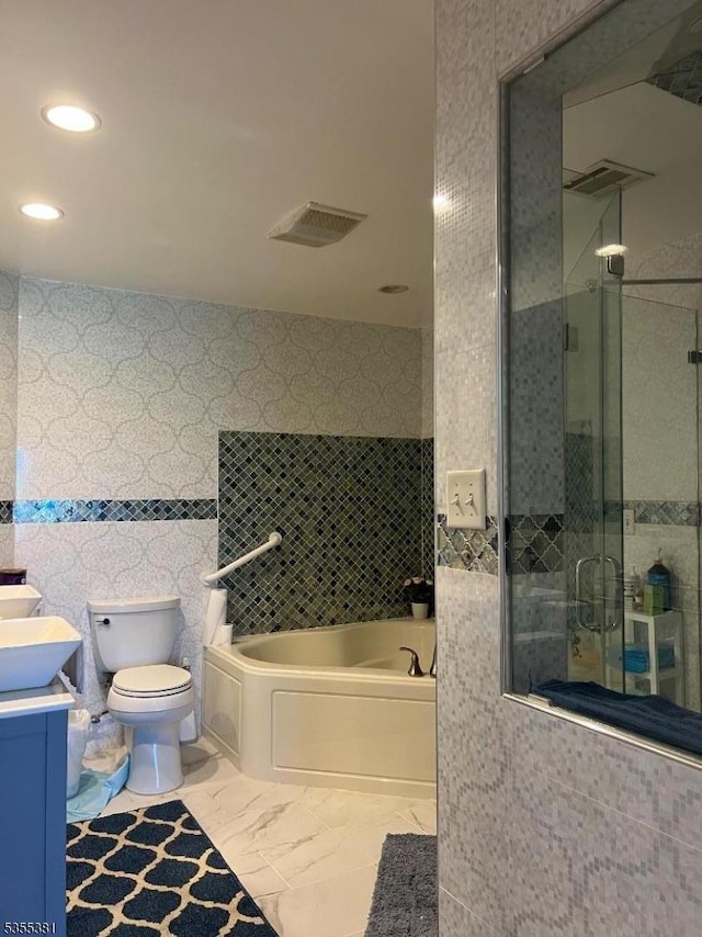 3 Harbor Front Ct Unit 3, Elizabeth City, NJ 07206 - bathroom with a stall shower, vanity, a bath, recessed lighting, and toilet