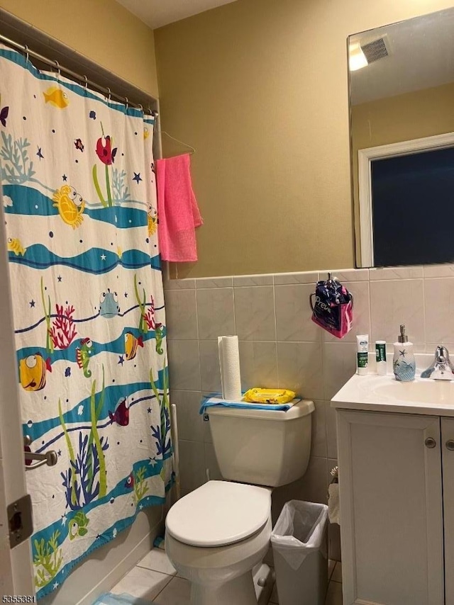 3 Harbor Front Ct Unit 3, Elizabeth City, NJ 07206 - full bathroom featuring toilet, vanity, tile patterned flooring, and tile walls