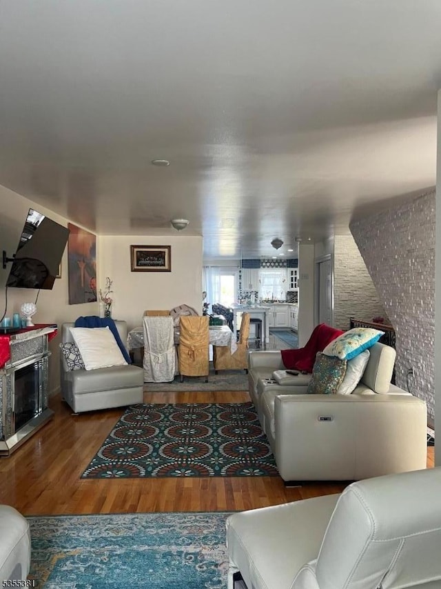 3 Harbor Front Ct Unit 3, Elizabeth City, NJ 07206 - living room with wood finished floors and a fireplace