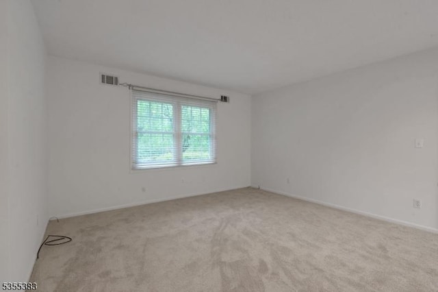 31 Charlotte Dr, Clinton Twp, NJ 08833 - empty room with light colored carpet and baseboards