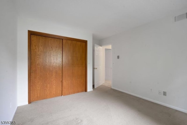 31 Charlotte Dr, Clinton Twp, NJ 08833 - unfurnished bedroom with light colored carpet, a closet, and baseboards