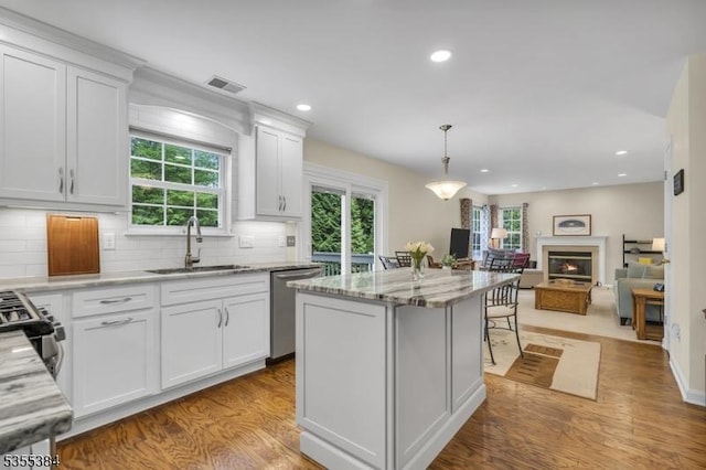 95 School House Rd, Jefferson Twp, NJ 07438 - kitchen featuring a sink, appliances with stainless steel finishes, wood finished floors, white cabinets, and recessed lighting