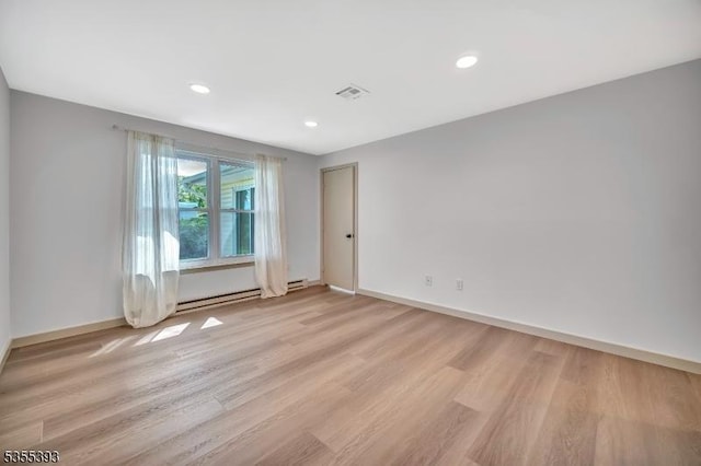 42B Catalpa Plz Unit B, Monroe Twp, NJ 08831 - spare room with light wood-style floors, baseboards, a baseboard heating unit, and recessed lighting