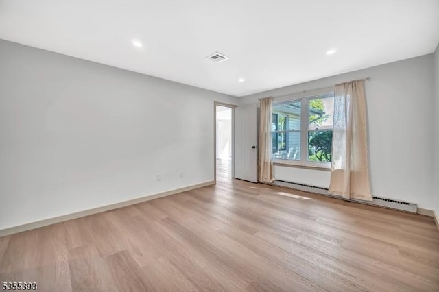 42B Catalpa Plz Unit B, Monroe Twp, NJ 08831 - spare room featuring wood finished floors, a baseboard heating unit, baseboards, and recessed lighting