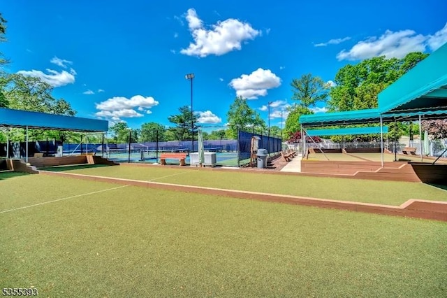 42B Catalpa Plz Unit B, Monroe Twp, NJ 08831 - view of property's community featuring a game area, fence, and a tennis court