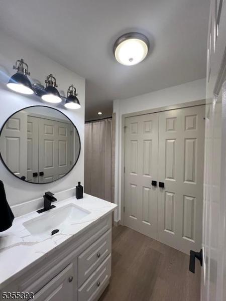 42B Catalpa Plz Unit B, Monroe Twp, NJ 08831 - full bathroom featuring wood finished floors and vanity