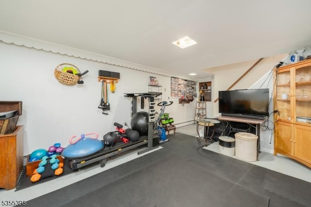 workout room featuring a baseboard radiator