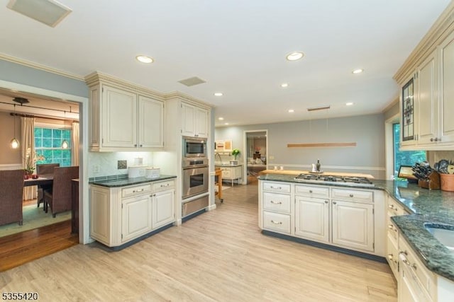 59 Green Hill Rd, Kinnelon Boro, NJ 07405 - kitchen with stainless steel appliances, a peninsula, light wood finished floors, cream cabinetry, and recessed lighting