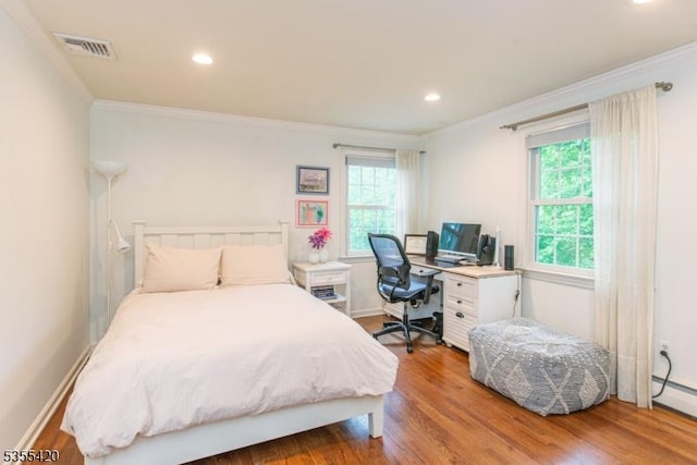 59 Green Hill Rd, Kinnelon Boro, NJ 07405 - bedroom with multiple windows, ornamental molding, wood finished floors, recessed lighting, and a baseboard radiator