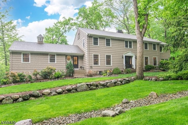 59 Green Hill Rd, Kinnelon Boro, NJ 07405 - colonial house featuring a chimney and a front lawn