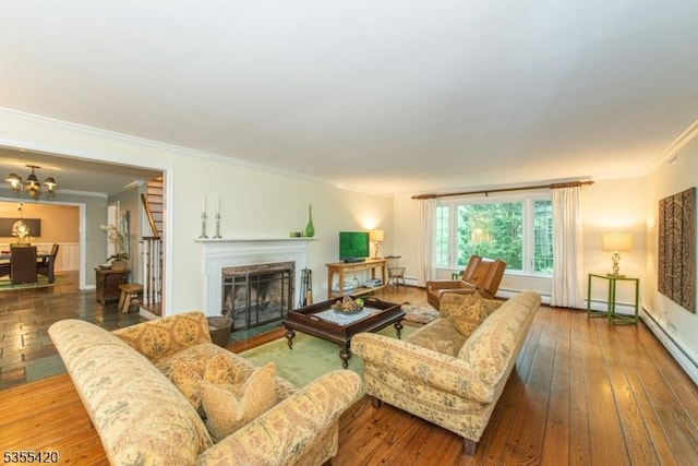 59 Green Hill Rd, Kinnelon Boro, NJ 07405 - living room featuring ornamental molding, a chandelier, a fireplace with flush hearth, wood-type flooring, and baseboard heating