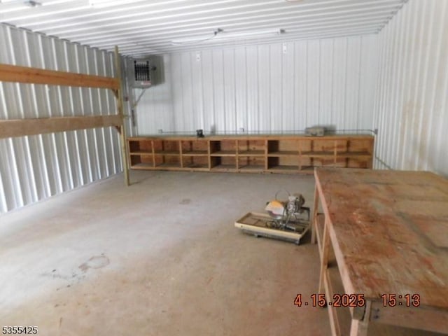 misc room featuring concrete floors and a garage